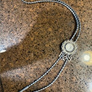 Elegant Silver and Black vintage 1929 bolo tie with Intricate Design